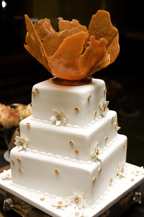 Vibrant rusts oranges and reds set the tone for the beautiful wedding decor